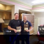 Commander Stacho and Captain Sulzer with plaques at Chili Cook Off