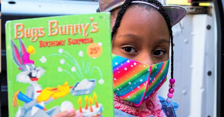 girl with bugs bunny book