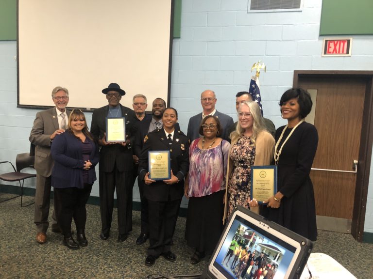 Fourth District Community Relations Award recipients with their awards.