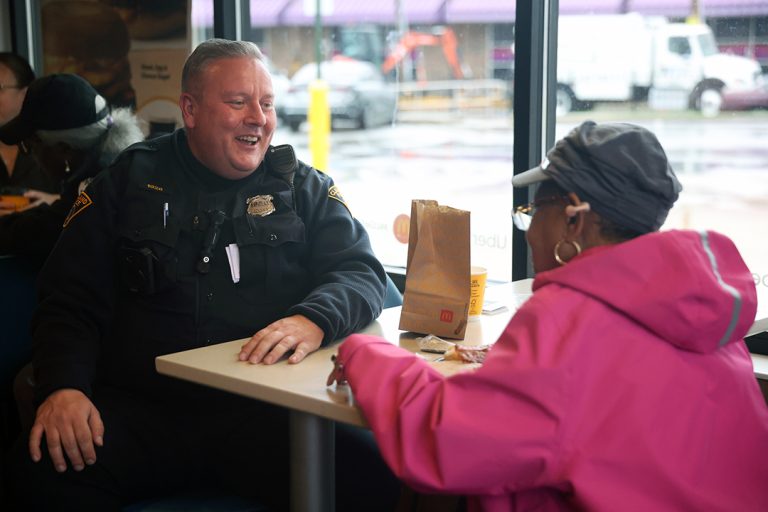 A police officer and community member and a recent Fifth District Coffee with a Cop event