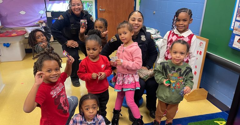 Fourth District Officers Jones and Harder with students at Andrew J. Rickoff School