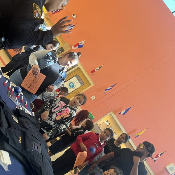 Students and families engage with CPD at an informational table