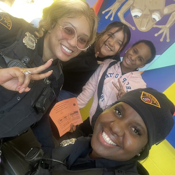 Officers Lavender and Simpson take a cheerful selfie with Buhrer students