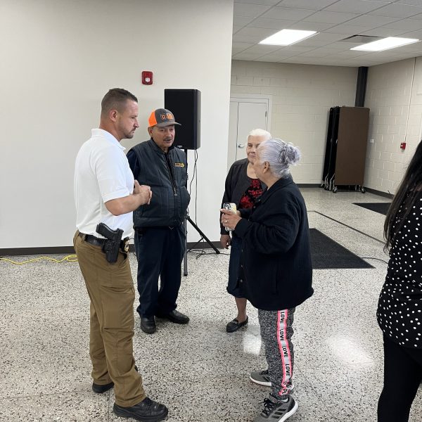 Commander Tim Maffo-Judd chats with several seniors during the appreciation event at the Hispanic Senior Center.