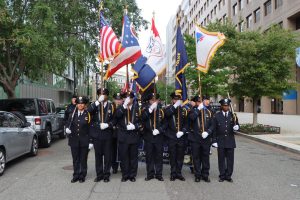 Honor Guard and flag bearers pause for a group photo before the march continues through downtown Washington, D.C.