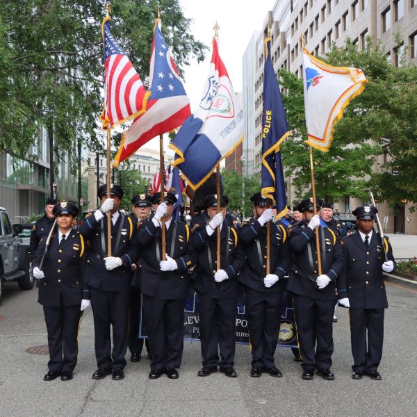 Honor Guard and flag bearers pause for a group photo before the march continues through downtown Washington, D.C.