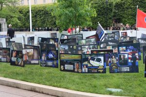 Memorial tribute garden filled with photo boards honoring fallen officers from across the country