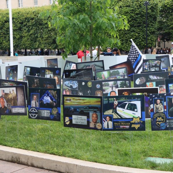 Memorial tribute garden filled with photo boards honoring fallen officers from across the country
