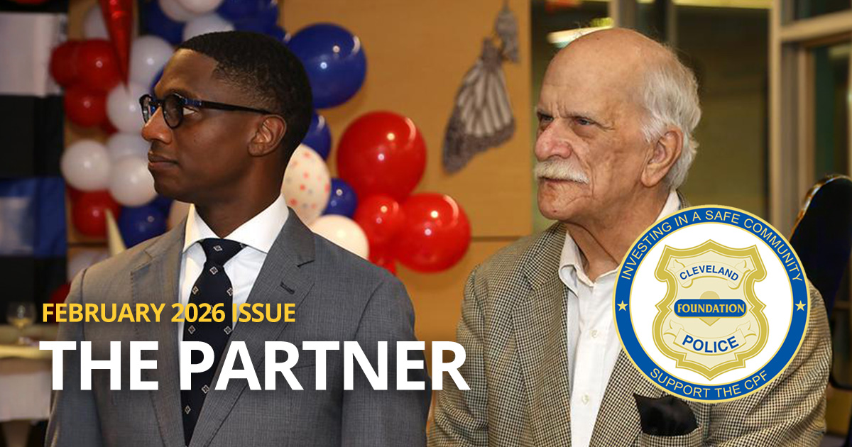 Dick Clough stands with Cleveland Mayor Justin Bibb during a Cleveland Police district community awards meeting, highlighted in the February 2026 issue of The Partner.